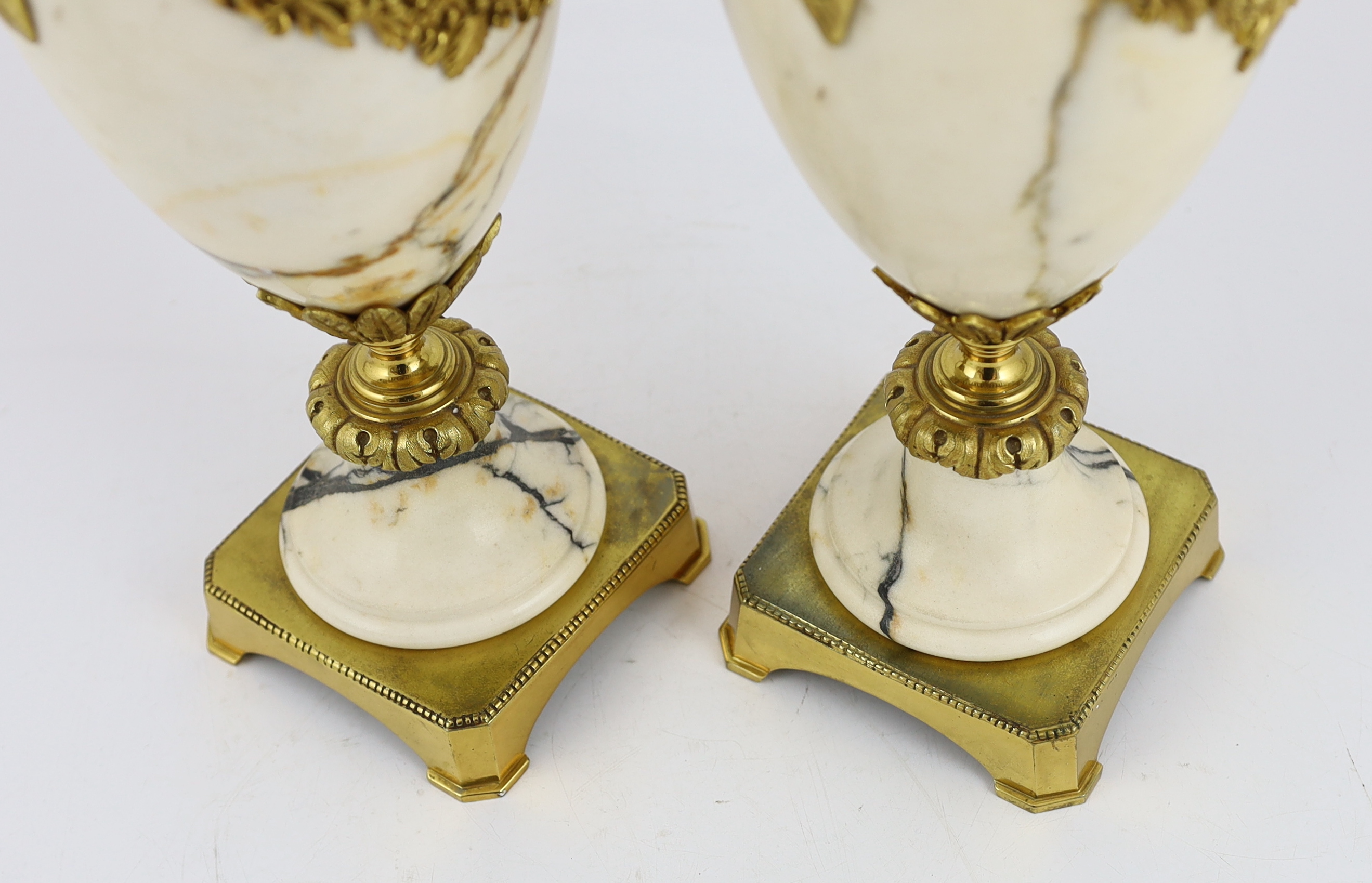 A pair of Italian ormolu mounted calacaita marble urns, 19cm wide, 44cm high